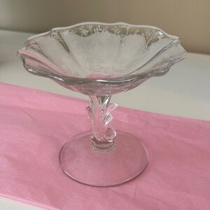 Glass pedestal dish use for Candy, place to put your rings while cooking
